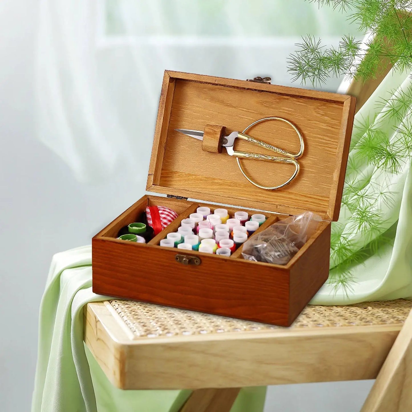 This empty vintage-inspired wooden sewing box is compact, travel-ready, and thoughtfully designed to hold your needlework essentials with timeless charm.